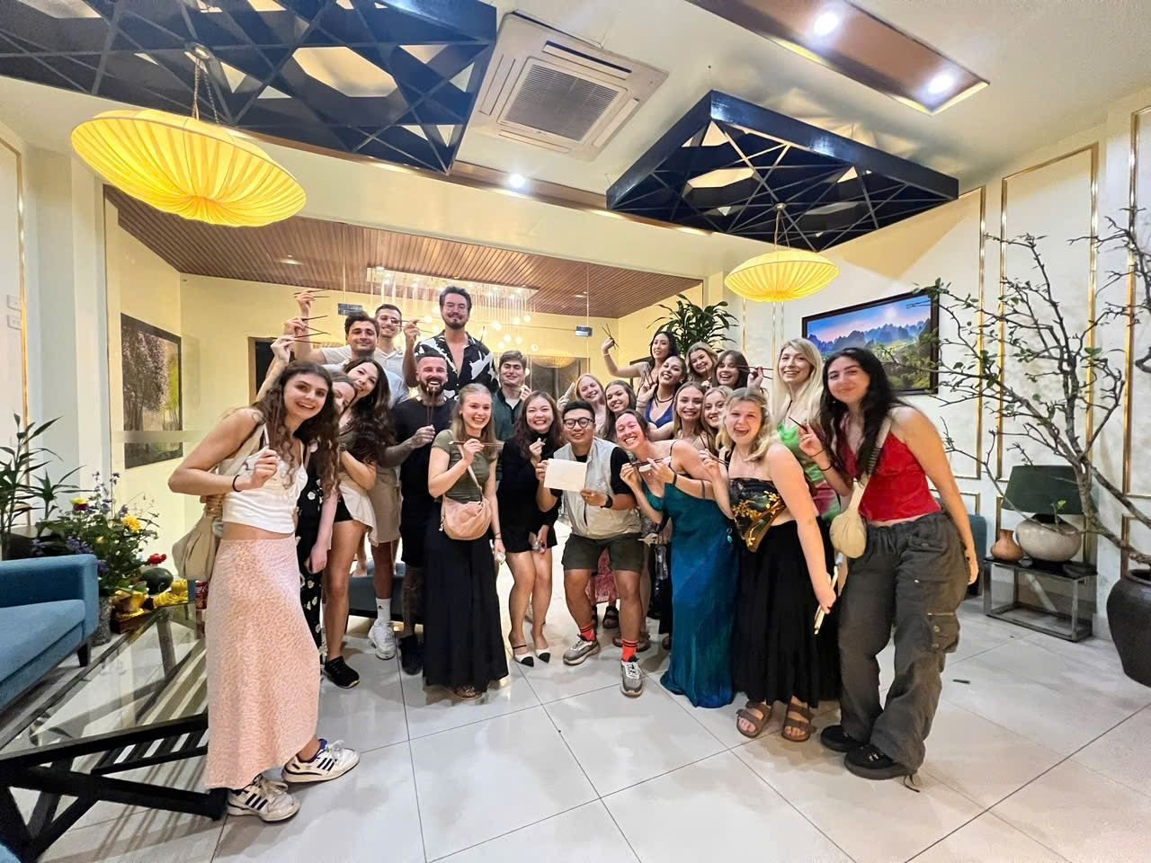 A tour group celebrating at dinner in Hoi An