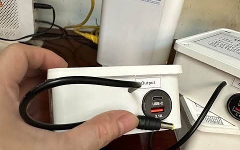Small UPS plugged into a 4G router on a desk